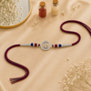 Trishul Crystal Silver Rakhi – 925 Sterling Silver Divine Trishul Rakhi with Red & Blue Crystal Beads