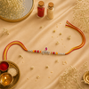 Krishna Rakhi – 925 Sterling Silver Rakhi with Pink Crystal, Red & Yellow Beads