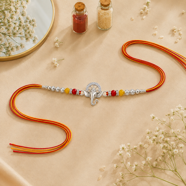 Bal Ganesha Silver Rakhi – 925 Sterling Silver Ganesha Rakhi with Ruby Red & Yellow Crystal Beads