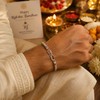 Bro Infinity Rakhi – 925 Sterling Silver Infinity Rakhi with Pastel Green & Peach Beads