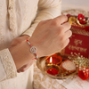 Ram Rakhi – 925 Sterling Silver Ram Symbol Rakhi with Ruby Red Crystal Beads