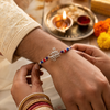 Om Namah Shivay Rakhi – 925 Sterling Silver Spiritual Rakhi with Red & Blue Beads