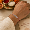 Bro Rakhi – 925 Sterling Silver Letter Rakhi with Red Crystal Beads