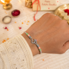 Om Rakhi – 925 Sterling Silver Om Rakhi with Pastel Green & Peach Beads
