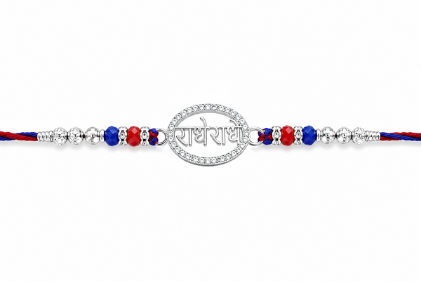Radhe Radhe Rakhi – 925 Sterling Silver Divine Radhe Radhe Rakhi with Ruby & Royal Blue Crystal Beads