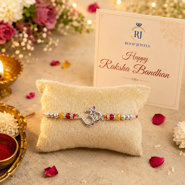 Om Rakhi – 925 Sterling Silver Divine Om Rakhi with Ruby & Golden Crystal Beads