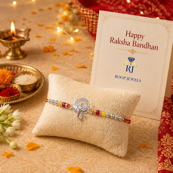 Bal Ganesha Silver Rakhi – 925 Sterling Silver Ganesha Rakhi with Ruby Red & Yellow Crystal Beads