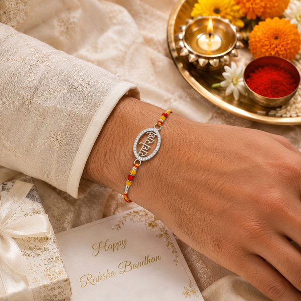 Radhe Radhe Rakhi – 925 Sterling Silver Divine Radhe Radhe Rakhi with Ruby & Golden Crystal Beads