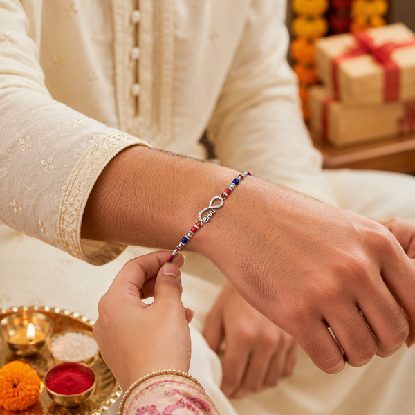 Bhai Rakhi – 925 Sterling Silver Infinity Rakhi with Red & Blue Beads