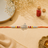 Om Namah Shivay Rakhi – 925 Sterling Silver Spiritual Rakhi with Red & Yellow Beads