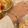 Om Namah Shivay Rakhi – 925 Sterling Silver Spiritual Rakhi with Red & Yellow Beads