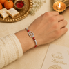 Radhe Radhe Rakhi – 925 Sterling Silver Rakhi with CZ Detailing & Red Thread
