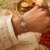 Bal Ganesha Silver Rakhi – 925 Sterling Silver Ganesha Rakhi with Ruby Red Crystal Beads