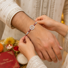 Shubh Swastik Silver Rakhi – 925 Sterling Silver Auspicious Swastik Rakhi with Ruby Red Crystal Beads